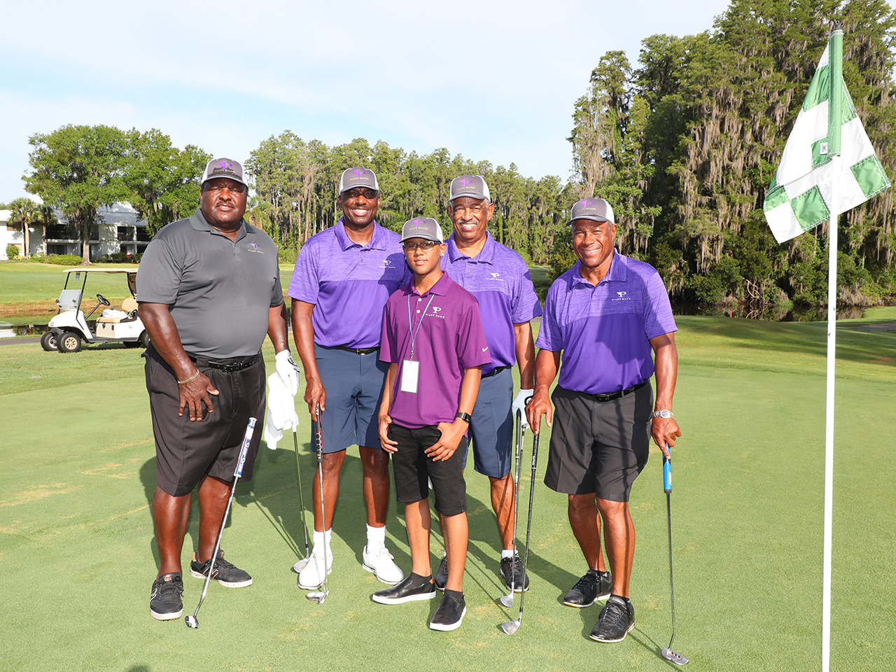 Jimmie Giles and Nat Moore captain their team for the golf tourney